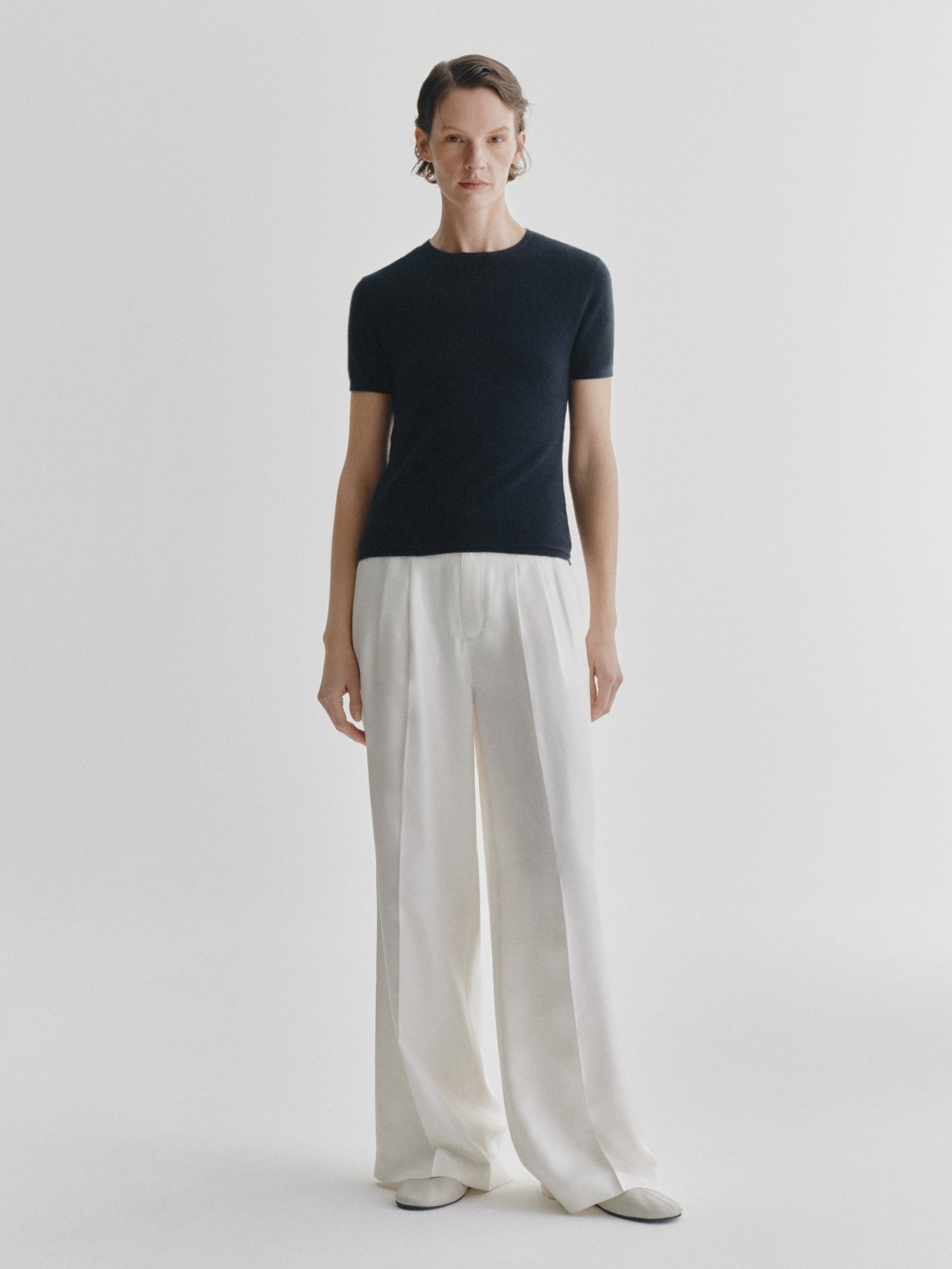 Lisa Yang Ira T-shirt styled with relaxed-fit, high-waisted linen trousers.