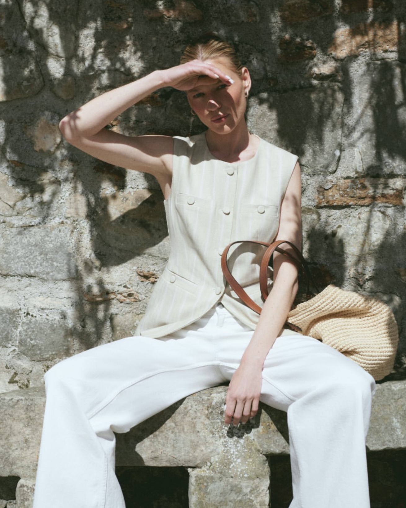 M.M.LaFleur's travel-friendly workwear styled with the Aliza Travel Vest and Milo All-Day Jeans.