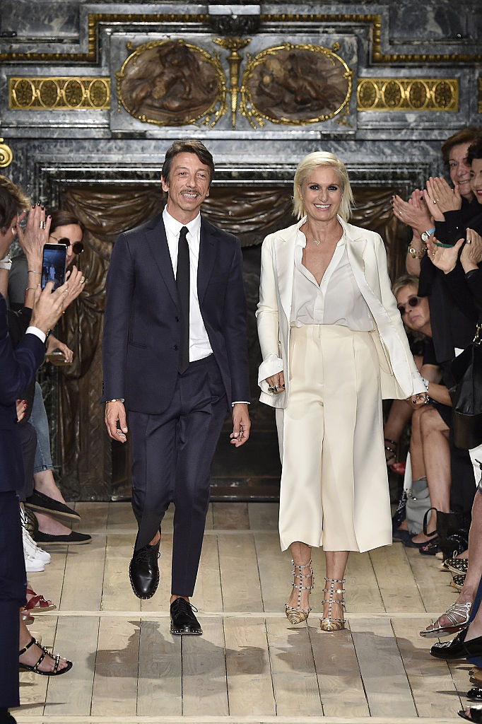 Pier Paolo Piccioli and Maria Grazia Chiuri acknowledge the audience during the Valentino Haute Couture Fall/Winter 2016-2017 show