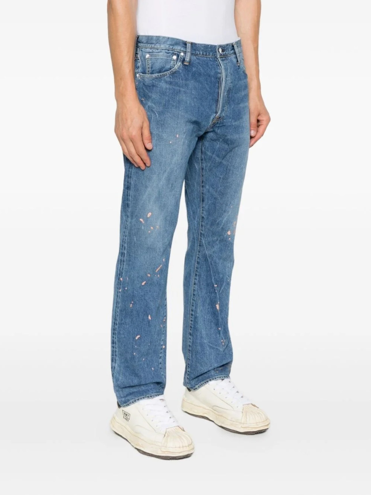 visvim Social Sculpture distressed jeans featuring hand-applied paint splatter detailing