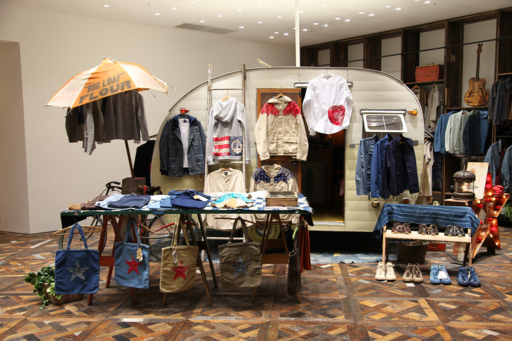 An archival 1950s antique camping vehicle re-engineered as the visvim F.I.L. Indigo Camping Trailer boutique in Tokyo.
