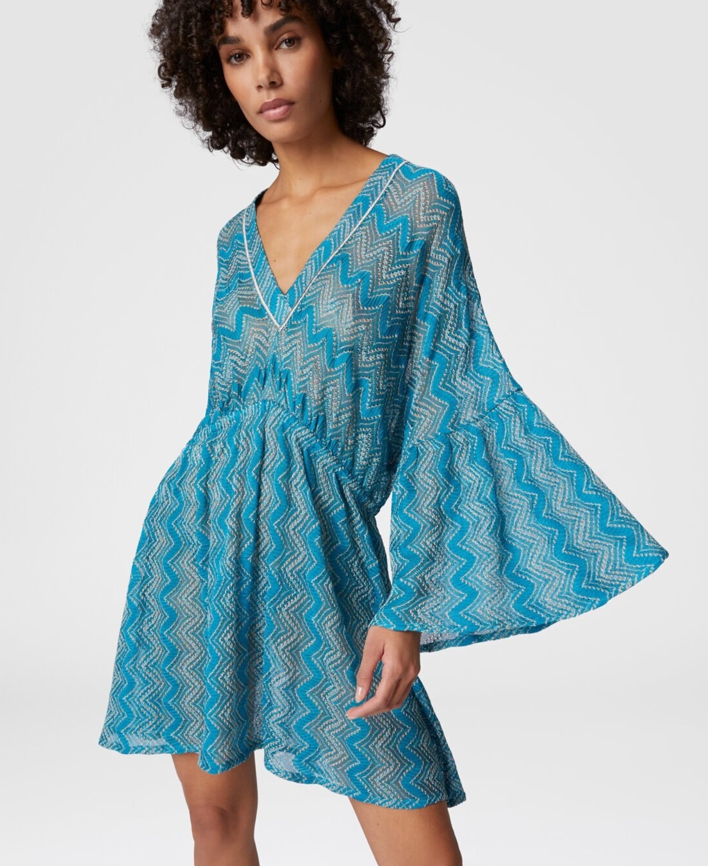 The Missoni Zigzag Lamé Cover-up Dress with flowing wide sleeves in a metallic Raschel knit.