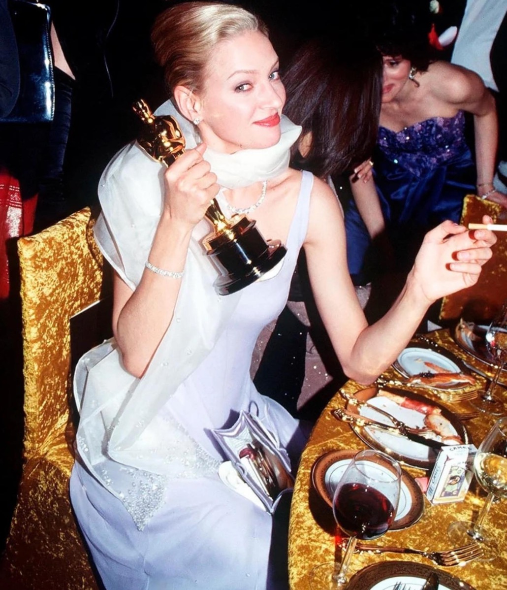 Uma Thurman attending the Oscars, wearing a Prada gown