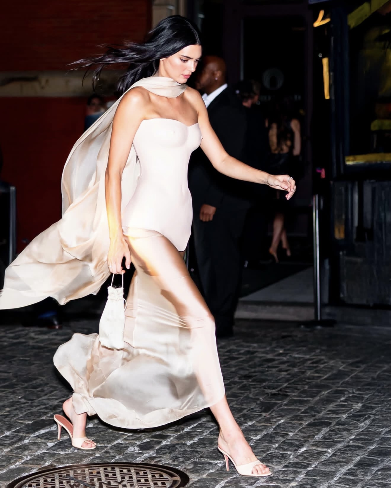 Kendall Jenner wearing the Amina Muaddi Elodie slipper in champagne patent leather at the Met Gala after-party