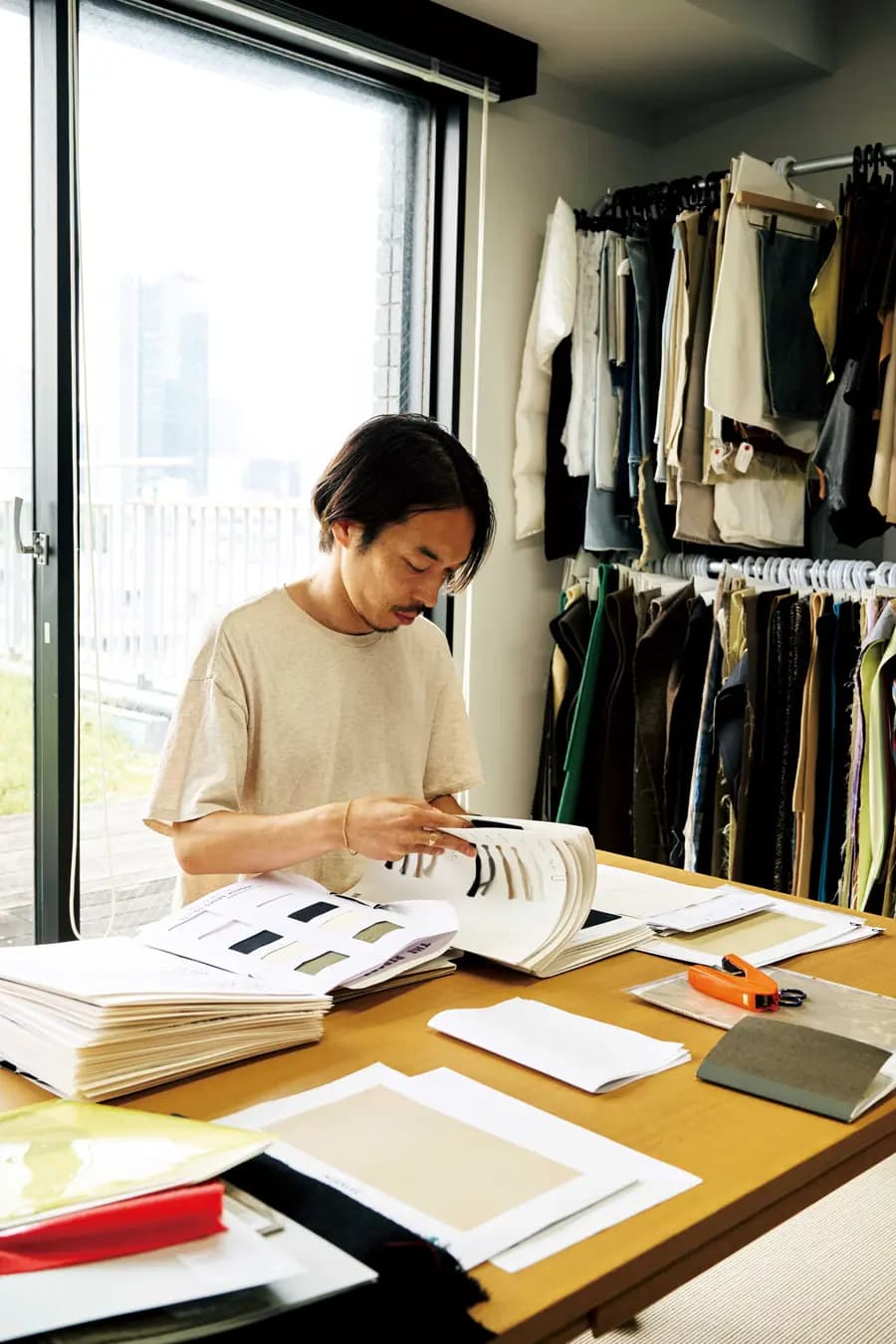 AURALEE founder and designer Ryota Iwai in his Tokyo design studio.
