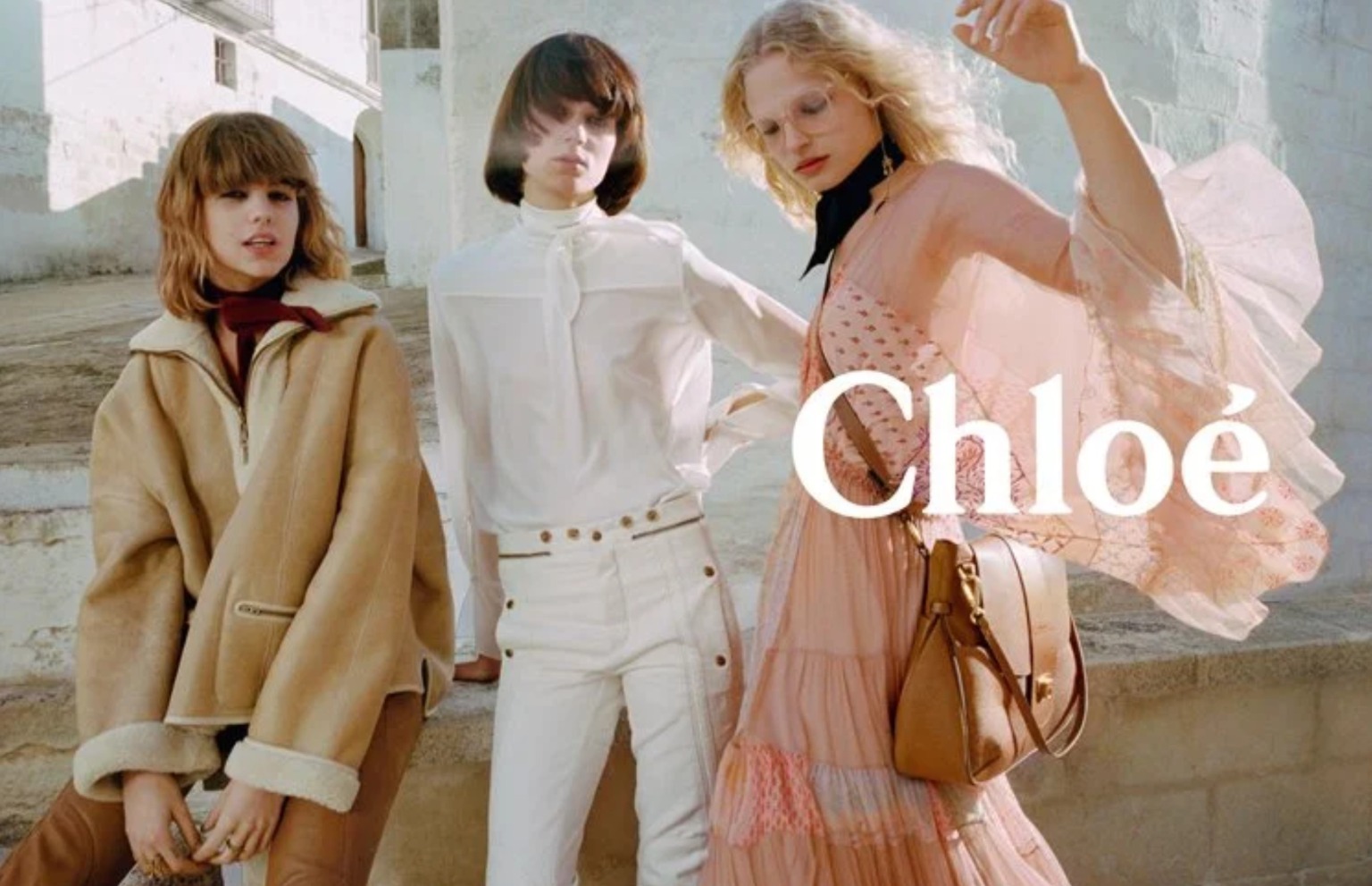 Chloe's bohemian style with silk blouse and tailored trousers