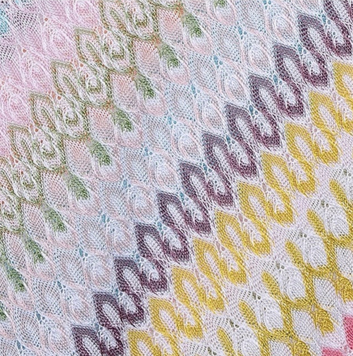 A vintage Raschel knitting loom crafting the signature Missoni chevron zigzag knitted fabric.